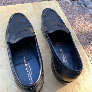 A pair of black Allen Edmonds Mercer Street Penny Loafers